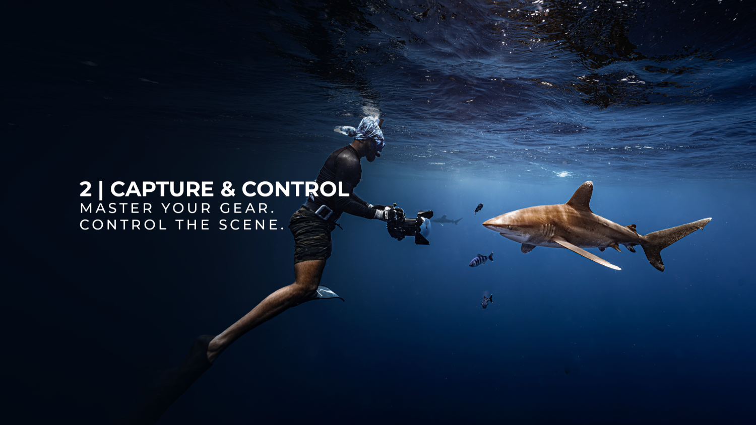 Underwater scene showing a diver holding a camera and a shark swimming nearby, with text on the left reading '2 | CAPTURE & CONTROL' and 'MASTER YOUR GEAR, CONTROL THE SCENE.'.